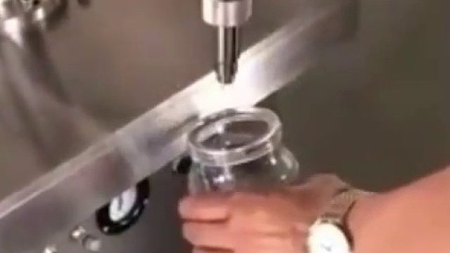 500毫升自动输送包装机,香精香料包装机