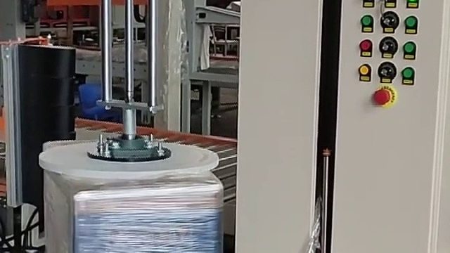 气动压顶型行李箱缠绕机