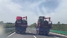 高速上遇到这种并排的货车怎么办？