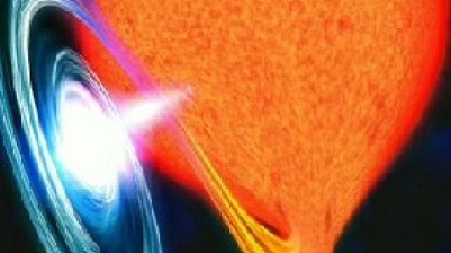 位于仙女座星系中央，一颗巨大黑洞将附近的一颗红巨星吞噬掉，那一刻的光亮照耀了整个仙女座星系。