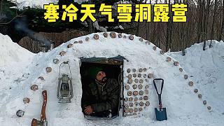 冬季户外营地和温暖的生存庇护所，建造原始雪屋，寒冷天气露营