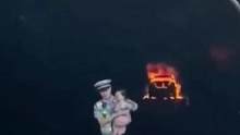 隧道内汽车突然自燃 交警怀抱幼儿迅速冲出隧道#五一假期 #汽车自燃 #感人一幕 (编辑：努尔波拉提)