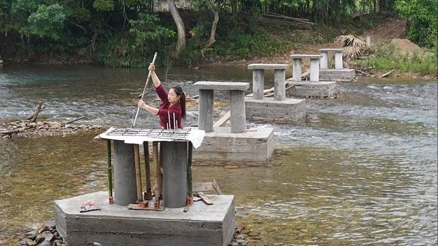 村里过河不便，我决定利用毕生所学，准备建造一座跨河大桥