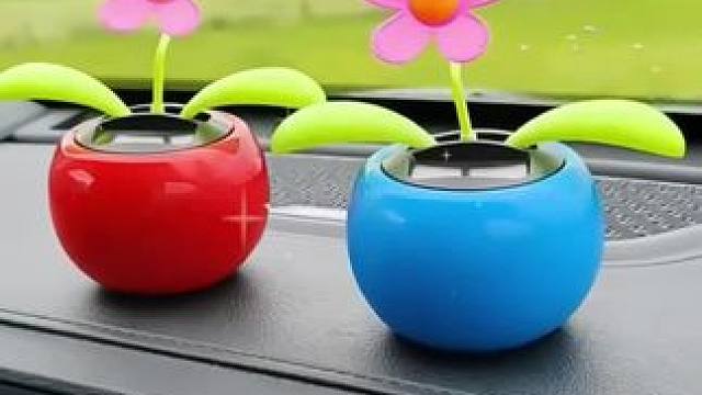 #创意摆件 美好心情需要美好事物来治愈，自动摇摆的苹果太阳花，看着心情就很愉快！寓意美好！#放松解压